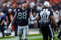 Raiders defensive end Maxx Crosby (98) chats with a referee during the second half of their NFL ...