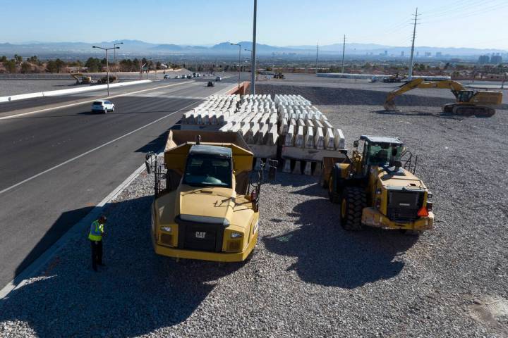 Heavy construction equipments and barriers are seen near the 215 Beltway and Summerlin Parkway, ...