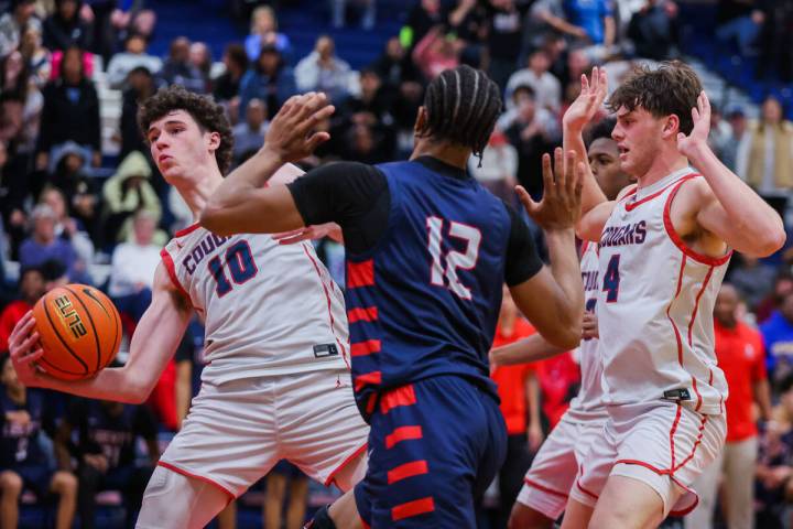 Coronado’s Mason Abittan (10) works the ball in the paint during a boys basketball game ...