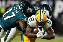 Green Bay Packers running back Josh Jacobs (8) is tackled by Philadelphia Eagles defensive tack ...