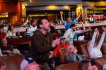 Philadelphia Eagles fans and bettors react to a touchdown against the Kansas City Chiefs while ...