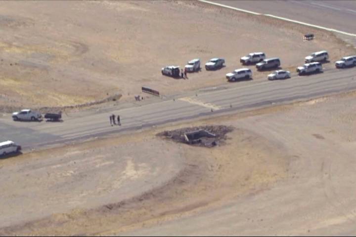 In this image taken from video, law enforcement at the site of a deadly plane crash at Marana R ...