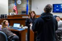 Hearing Master Shannon Wittenberger speaks with a program graduate during adult drug court at t ...