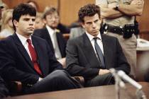 Lyle, left, and Erik Menendez sit in Beverly Hills Municipal Court where their attorneys delaye ...