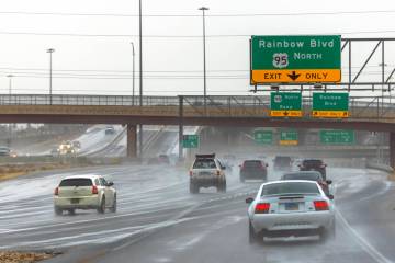 Drivers navigate the U.S. Highway 95 south as rain moves through the valley on Feb. 13, 2025 in ...