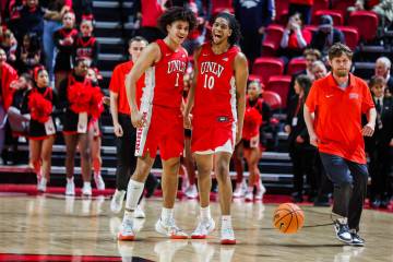 Rebels forward Jalen Hill (1) and Rebels guard Jaden Henley (10) celebrate winning a NCAA men&# ...