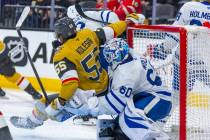 Golden Knights right wing Keegan Kolesar (55) crashes into Toronto Maple Leafs goaltender Josep ...