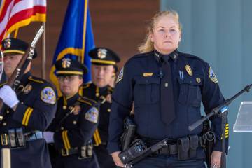 Henderson Police Chief Hollie Chadwick stands at attention as the colors are presented during t ...