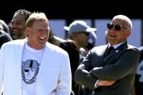 Raiders owner Mark Davis, left, and president Marc Badain share a laugh before an NFL game agai ...