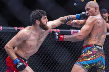 Magomed Ankalaev punches Alex Pereira in the face during their light heavyweight fight at UFC 3 ...