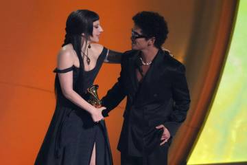 Lady Gaga, left, and Bruno Mars accept the award for best pop duo/group performance for "D ...