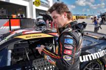 Noah Gragson puts in his ear plugs as he gets ready for practice at the NASCAR Daytona 500 auto ...