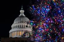 The Capitol Christmas tree is illuminated in Washington on Thursday, Dec. 19, 2024. For the fir ...