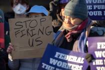 Demonstrators rally in support of federal workers outside of the Department of Health and Human ...