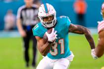 Miami Dolphins running back Raheem Mostert (31) carries the ball during an NFL football game ag ...